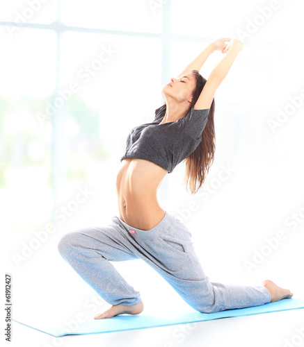 Photo: Fit young female training physically at the gym Fit young female training physically at the gym