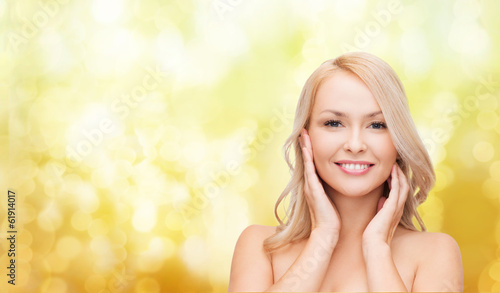Photo: woman touching her face skin woman touching her face skin