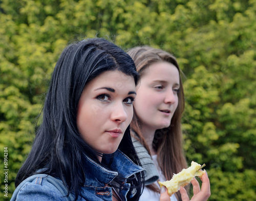 Photo: Young woman eating an apple Young woman eating an apple