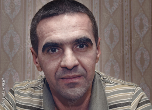 Photo: Middle-aged man with a serious intent expression Middle-aged man with a serious intent expression