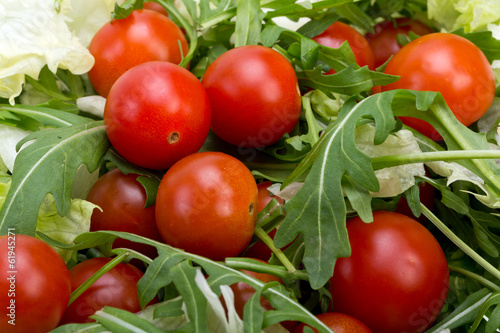 Photo: Heap of ruccola leaves and cherry tomatoes Heap of ruccola leaves and cherry tomatoes
