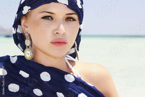 Photo: Beautiful Woman on the Beach.Arab Fashion.Sea Landscape.Summer Beautiful Woman on the Beach.Arab Fashion.Sea Landscape.Summer