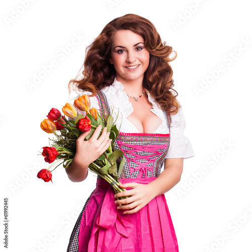 Photo: junge Frau im Dirndl mit Tulpen junge Frau im Dirndl mit Tulpen