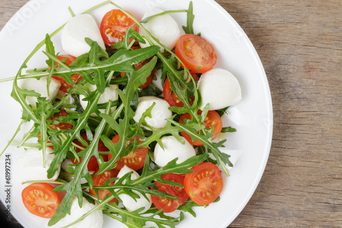 Photo: salad from arugula tomatos and baby mozzarella salad from arugula tomatos and baby mozzarella
