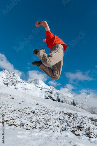 Photo: Hiker jumps in Himalaya mountains Hiker jumps in Himalaya mountains
