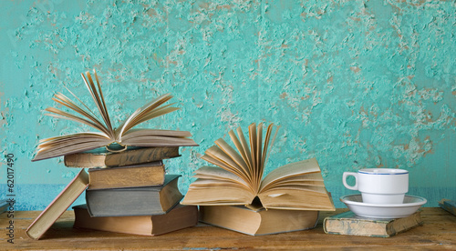 Photo: vintage books with a coffee cup, free copy space vintage books with a coffee cup, free copy space