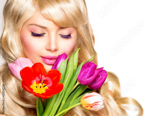 Photo: Beauty Woman with Spring Flower bouquet Beauty Woman with Spring Flower bouquet
