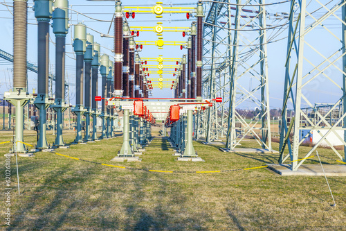 Photo: hight voltage tower in rural landscape with blue sky hight voltage tower in rural landscape with blue sky