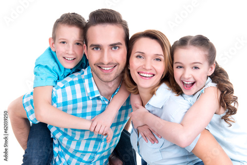 Photo: Portrait of the happy european family with children Portrait of the happy european family with children