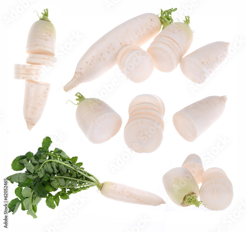 Photo: Daikon radishes isolated on white background Daikon radishes isolated on white background
