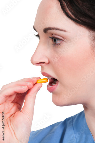 Photo: Woman Taking Pill Woman Taking Pill