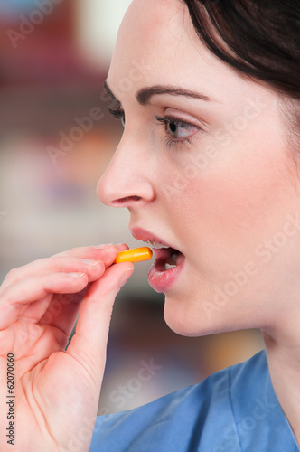 Photo: Woman Taking Pill Woman Taking Pill