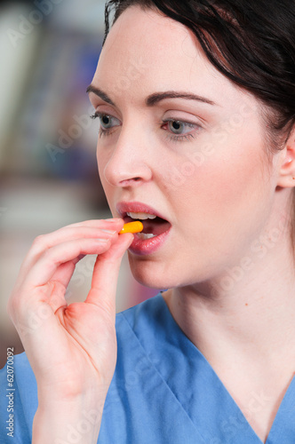 Photo: Woman Taking Pill Woman Taking Pill