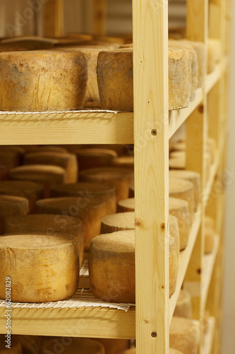 Photo: Cheese madurating in storage room Cheese madurating in storage room