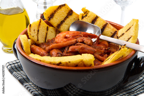 Photo: fish soup with grilled polenta on crock pot fish soup with grilled polenta on crock pot