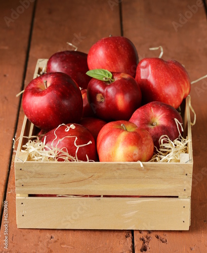 Photo: fresh ripe organic red apples in a wooden box fresh ripe organic red apples in a wooden box