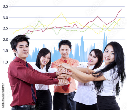 Photo: Business team overlapping hands Business team overlapping hands