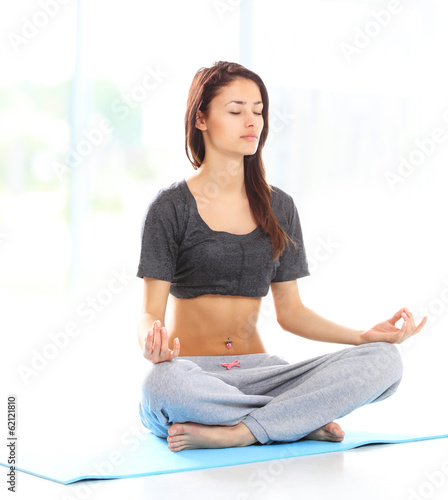 Photo: Fit young female training physically at the gym Fit young female training physically at the gym