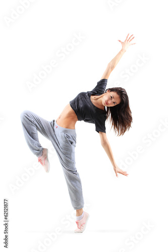 Photo: pretty modern slim hip-hop style teenage girl jumping dancing pretty modern slim hip-hop style teenage girl jumping dancing