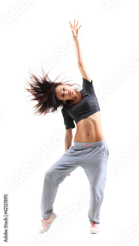 Photo: pretty modern slim hip-hop style teenage girl jumping dancing pretty modern slim hip-hop style teenage girl jumping dancing