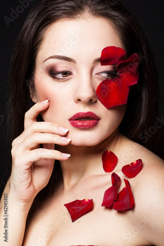 Photo: Fashion portrait of woman with rose petals Fashion portrait of woman with rose petals