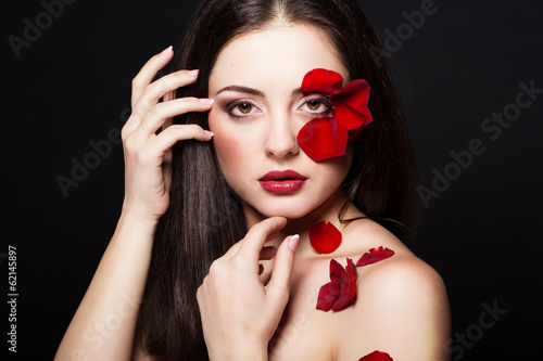 Photo: Fashion portrait of woman with rose petals Fashion portrait of woman with rose petals