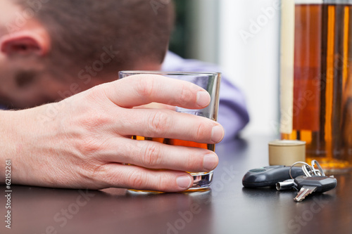 Photo: Drunk driver sleeping on table Drunk driver sleeping on table