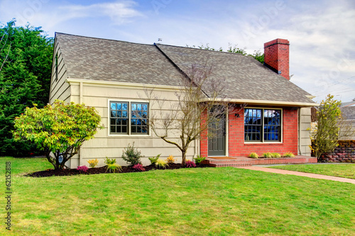 Photo: Beautiful small siding house with a brick trim wall Beautiful small siding house with a brick trim wall