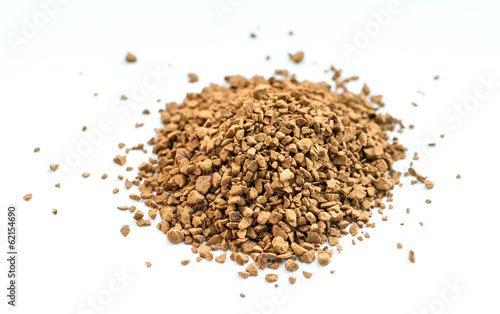 Photo: Instant coffee granules on white. Shallow depth of field. Instant coffee granules on white. Shallow depth of field.
