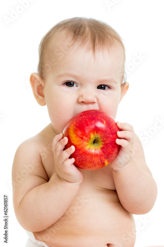 Photo: Baby eating apple, isolated on white Baby eating apple, isolated on white