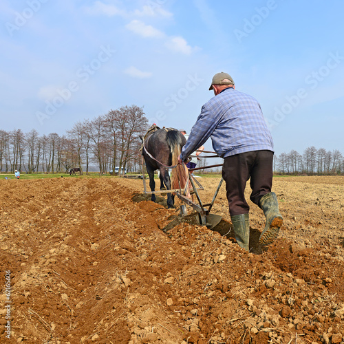 Photo: Fallowing of a spring field by a manual plow on horse-drawn Fallowing of a spring field by a manual plow on horse-drawn