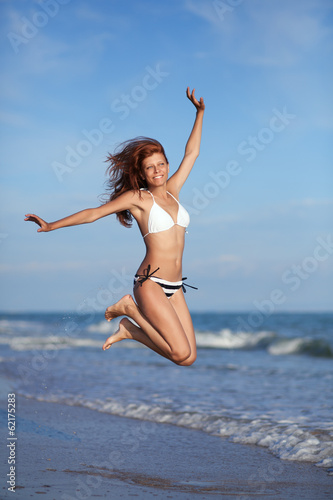 Photo: Beauty woman on sea beach Beauty woman on sea beach