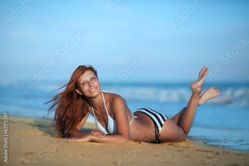 Photo: Beauty woman on sea beach Beauty woman on sea beach