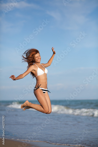 Photo: Beauty woman on sea beach Beauty woman on sea beach