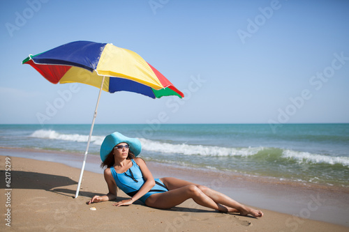 Photo: Beauty woman on sea beach Beauty woman on sea beach