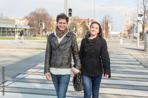Photo: Young Couple Crossing Road on Zebra Crossing Young Couple Crossing Road on Zebra Crossing