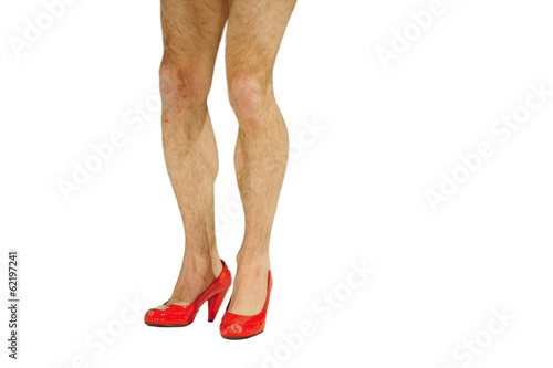 Photo: Man in woman shoes on high heel Man in woman shoes on high heel