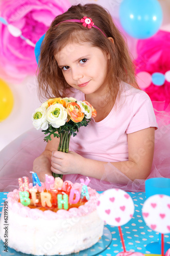 Photo: Pretty little girl celebrate her birthday Pretty little girl celebrate her birthday
