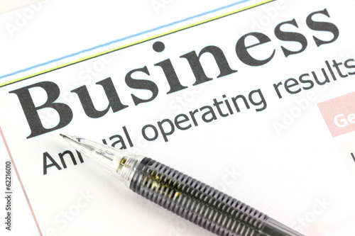 Photo: Mechanical pencil point to Business text on graph. Mechanical pencil point to Business text on graph.