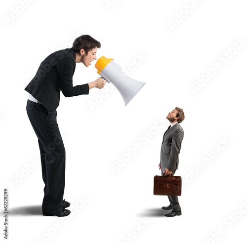 Photo: Businesswoman shouting through a megaphone Businesswoman shouting through a megaphone
