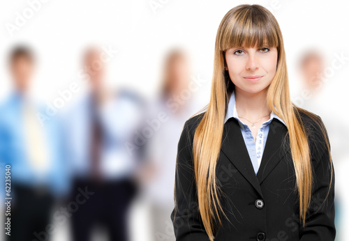 Photo: Businesswoman in front of her team Businesswoman in front of her team