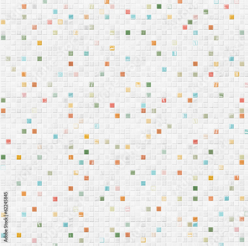 Photo: white tile wall background with colorful pieces white tile wall background with colorful pieces