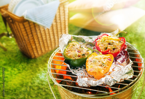 Photo: Stuffed savory sweet peppers grilling on foil Stuffed savory sweet peppers grilling on foil