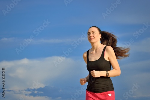 Photo: Woman jogging outdoors Woman jogging outdoors
