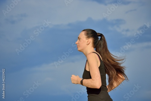 Photo: Woman jogging outdoors Woman jogging outdoors
