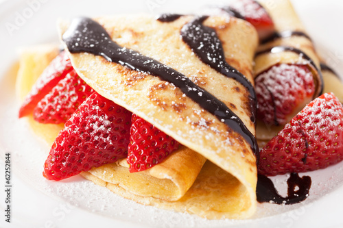 Photo: pancakes with strawberry and chocolate sauce pancakes with strawberry and chocolate sauce