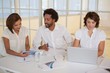 Business people using digital tablet and laptop in meeting Business people using digital tablet and laptop in meeting