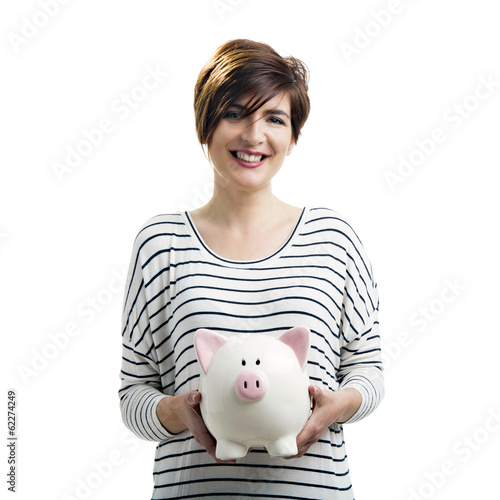 Photo: Beautiful happy woman with a piggybank Beautiful happy woman with a piggybank