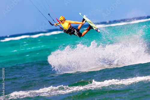 Photo: jumping kitesurfer on sea background Extreme Sport Kitesurfing jumping kitesurfer on sea background Extreme Sport Kitesurfing