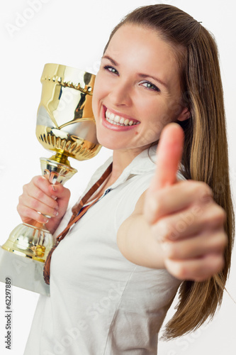 Photo: Beautiful young women win a trophy Beautiful young women win a trophy